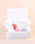 Personalised baby gift set with embroidered hooded towel and pastel animal toys in keepsake gift box