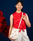 Girl in red top and crossbody bag, DSC00054