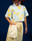 Girl in floral top with purse, DSC00408