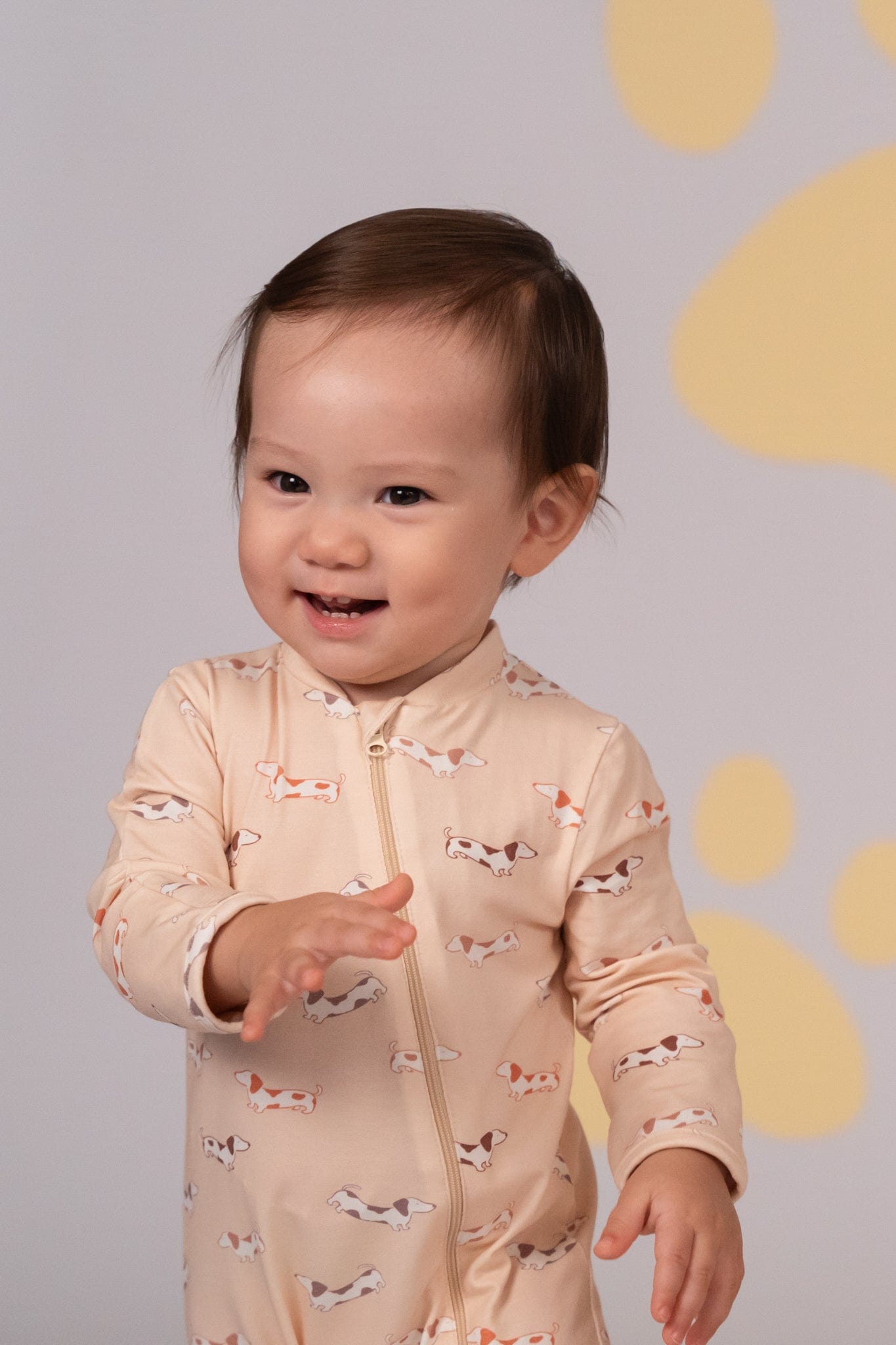 Baby smiling in dog-print onesie, DSC03967
