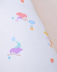 Close-up of exploded pillow with mermaid pattern