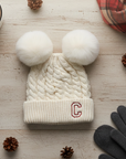 White knit beanie with double poms flay lay
