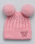 Pink knitted beanie with double pom-poms