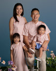 Family portrait in matching pink outfits