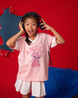 Girl in Stitch Angel tee shirt with headphones