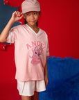 Girl in Stitch Angel tee shirt and hat