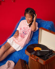 Girl wearing Stitch tee shirt with record player