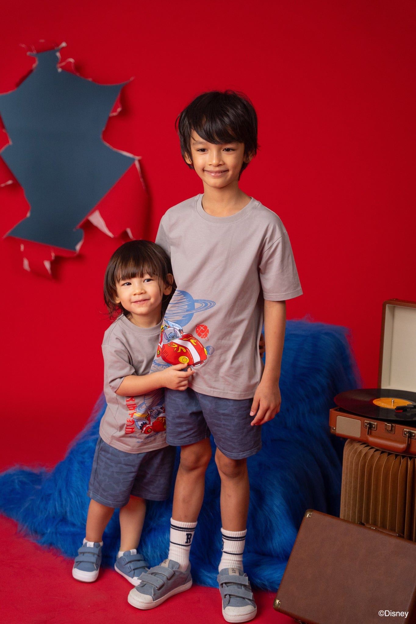Two boys wearing Stitch t-shirts