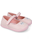 Pair of pink children's shoes with butterfly designs on a white background
