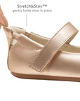 Close-up of the metallic salmon leather heel with Stretch & Stay elastic for a secure, easy-on fit for infants.