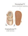 Top and bottom view of metallic salmon Mary Janes highlighting the wide toe box and barefoot-feel sole technology.