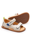 Pair of Tip Toey Joey Explore Born to Move Sandals in Tapioca, baby first walker shoes