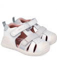 White children's sandals with gray straps on a white background
