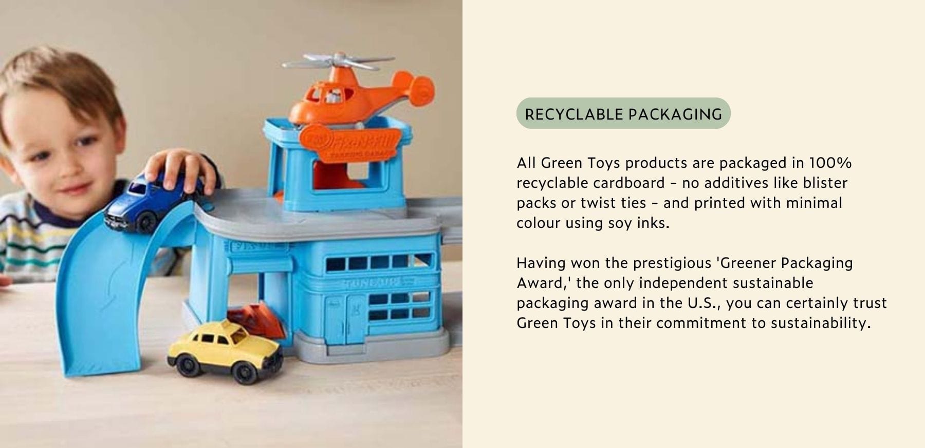 Green Toys playset with recyclable packaging, shown with a child.