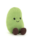 Green bean plush toy with a smiling face on a white background