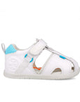 White sandal with blue accents on a white background