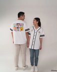 parents wearing matching white baseball jerseys with pop mickey and friends