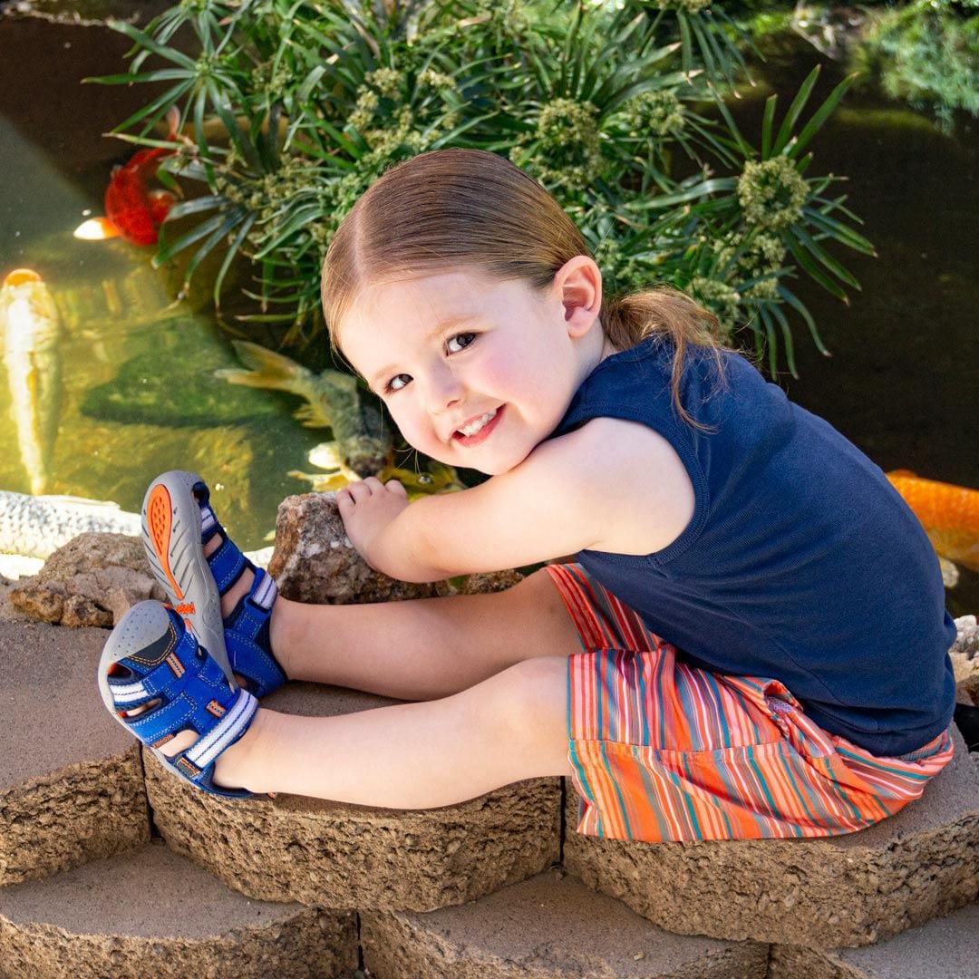 Pediped sandals on smiling girl at pond