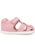 Pink sandal with a white sole on a white background