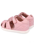 Pair of pink children's sandals on a white background