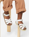 White Saltwater sandals on child's feet