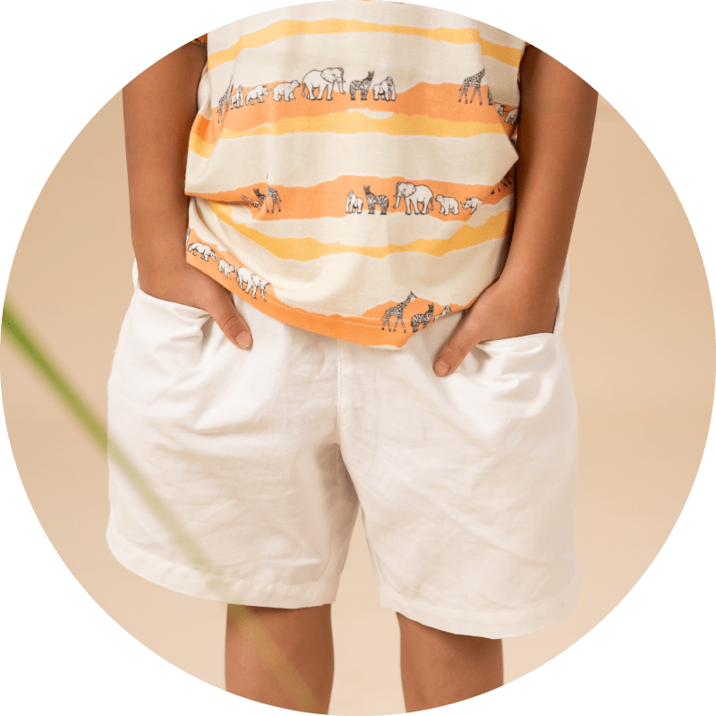 White shorts with safari-themed shirt