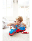 Boy playing with blue toy train
