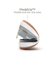 Demonstrating the flexible FlexiGrip rubber sole on the baby Tide Blue leather loafer for natural movement.