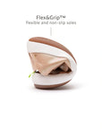 Demonstrating the flexible FlexiGrip rubber sole on the baby candy dream pink leather sneaker.