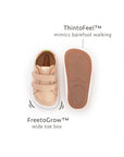 Front and bottom view of candy dream baby sneakers highlighting the wide toe box and flexible gum sole.