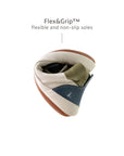 Demonstrating the flexible FlexiGrip rubber sole on the baby Metropoly leather high-top sneaker.