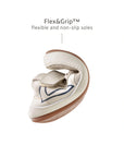 Demonstrating the flexible FlexiGrip rubber sole on the baby Outline sneaker for natural foot movement.