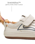 Close-up of the Stretch & Stay elastic heel on the baby Outline sneaker for a secure and easy fit.