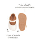 White dream baby shoe diagram highlighting the FreetoGrow wide toe box and ThintoFeel thin sole.