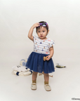 Child wearing Tulle onesie nautical mickey and holding sunglasses