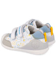 Children's shoe with dinosaur design and grey and blue accent on a white background