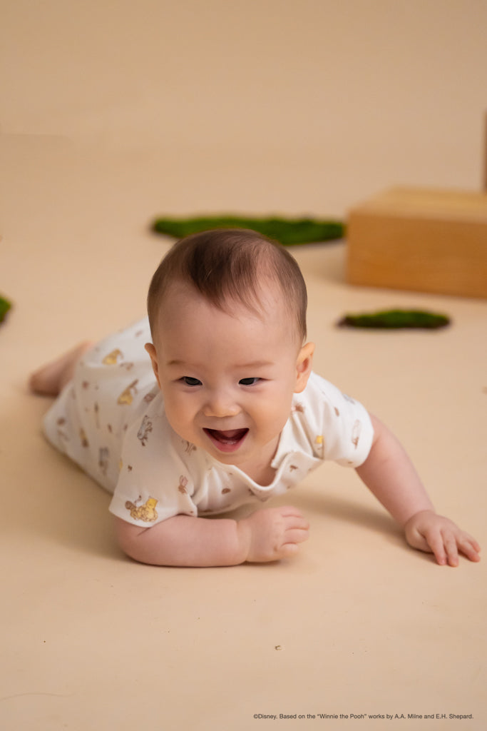 Caleb Romper Dandelion Pooh crawling