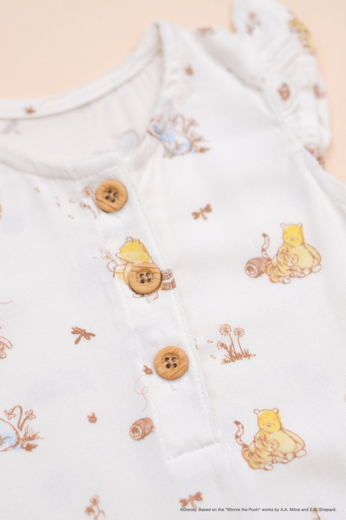 Caitlyn Romper Dandelion Pooh buttons
