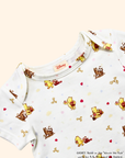 Close-up of white baby tee with Classic Pooh print, soft cotton fabric and gentle neckline