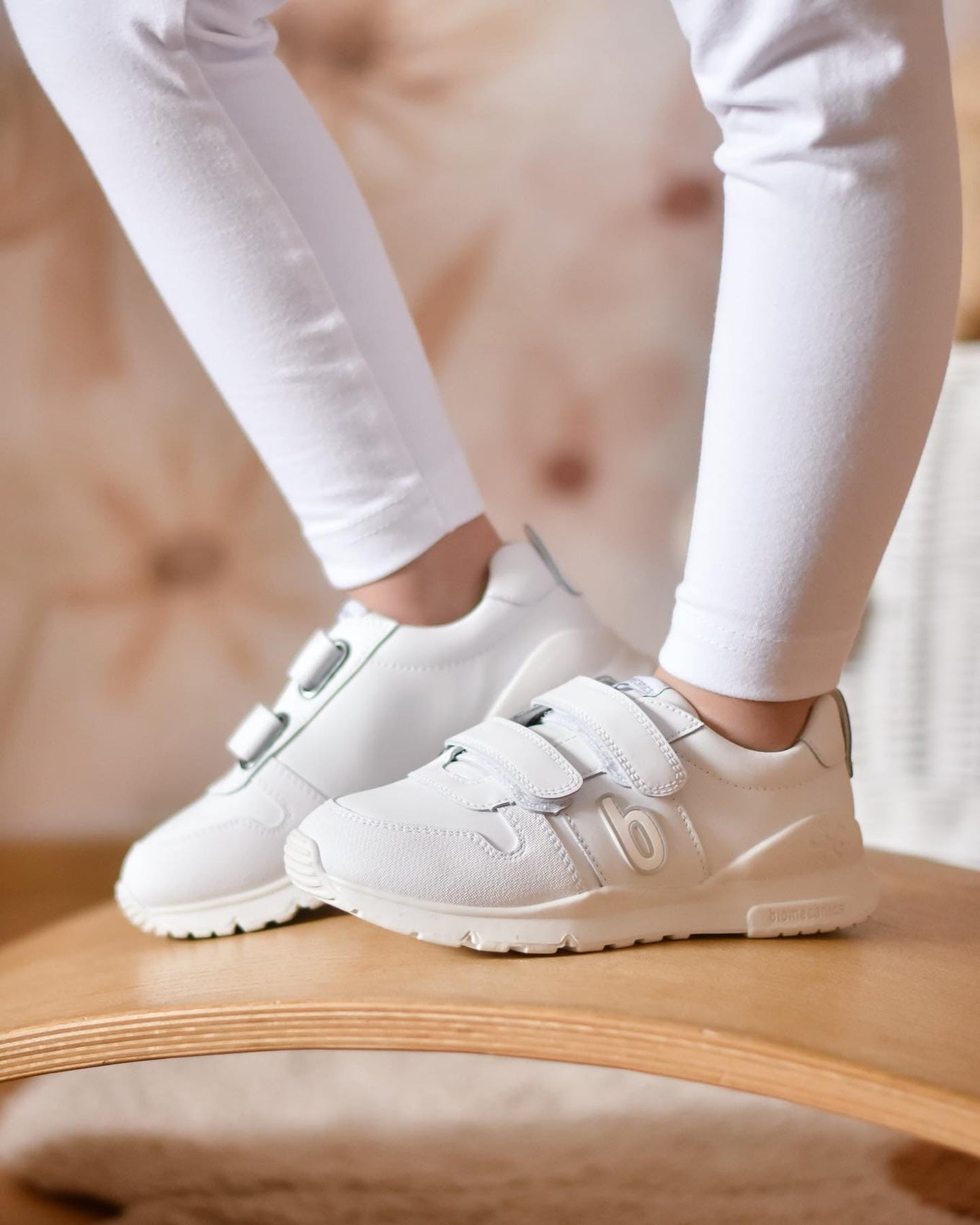 White sneakers on a child's feet