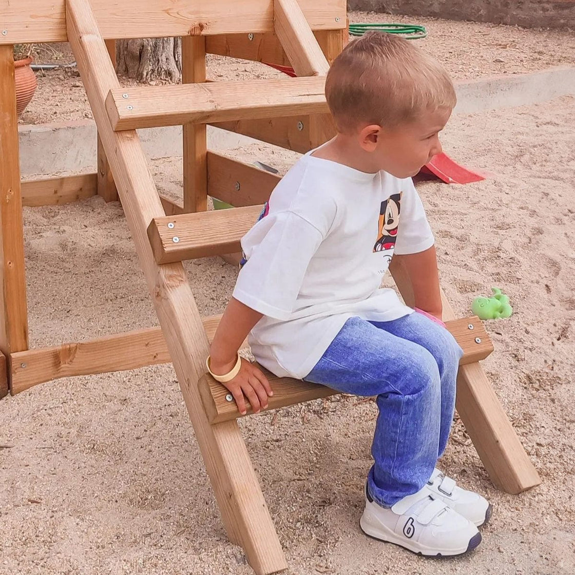Child on wooden ladder