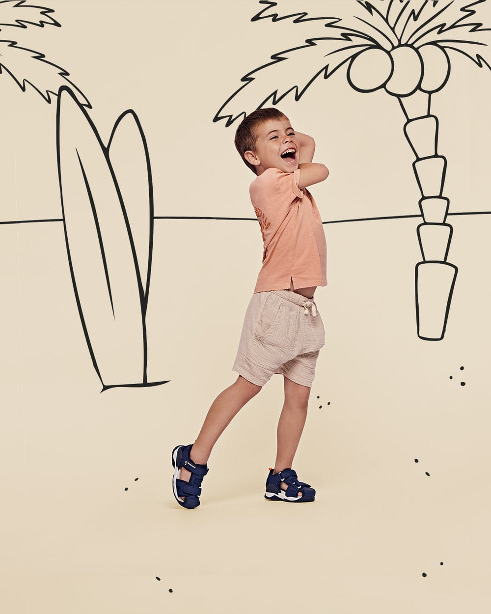 boy by a beach scene