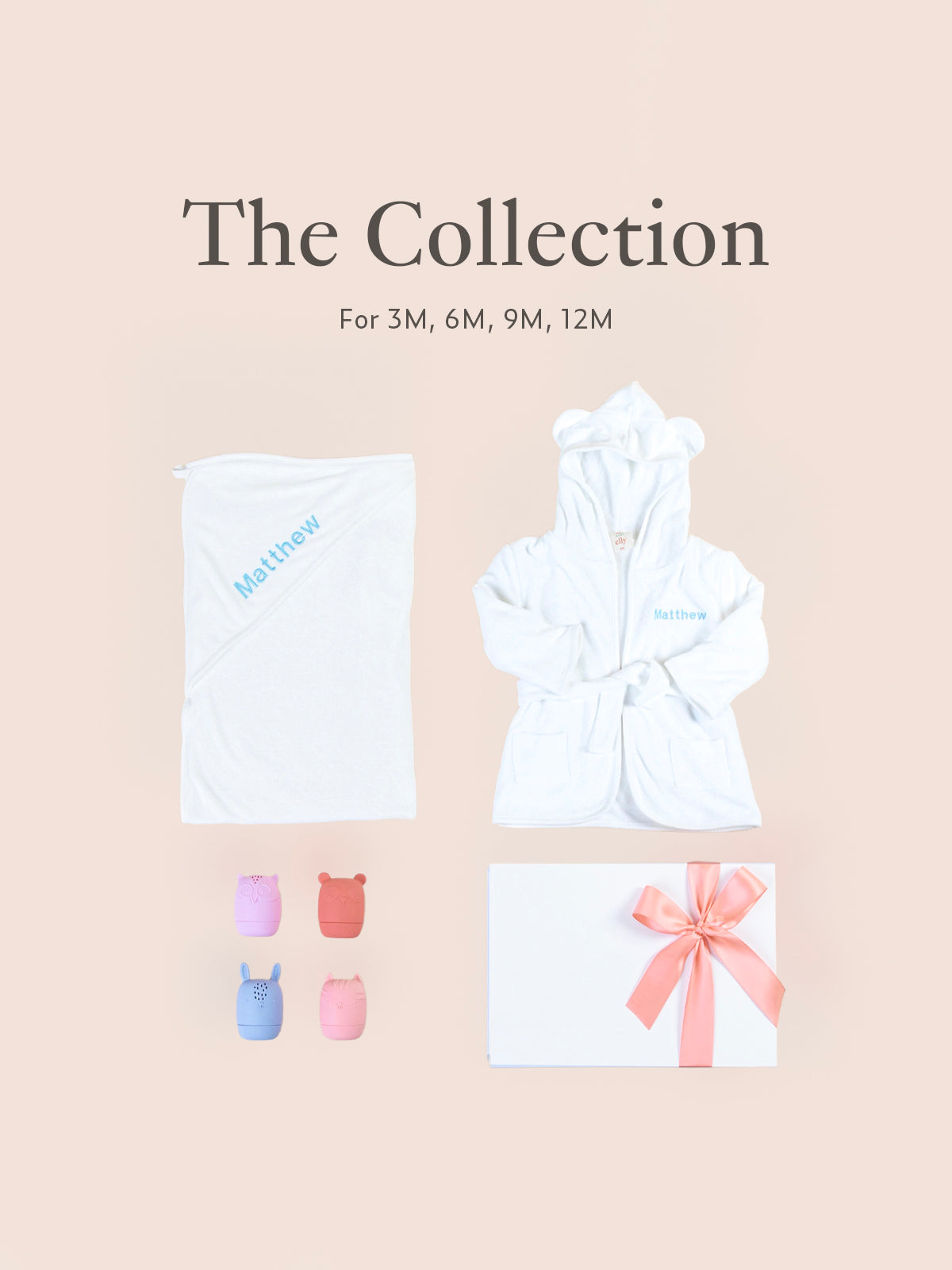 Flatlay of personalised baby gift set with towel, animal toys, gift box, and ribbon packaging