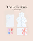 Flatlay of personalised baby gift set with towel, animal toys, gift box, and ribbon packaging