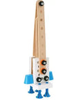 A wooden toy rocket with a natural wood body, blue cone-shaped fins, blue legs, and black and orange screws, shown on a plain white background.