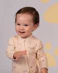 Baby smiling in dog-print onesie, DSC03967