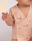 Baby in dachshund print onesie