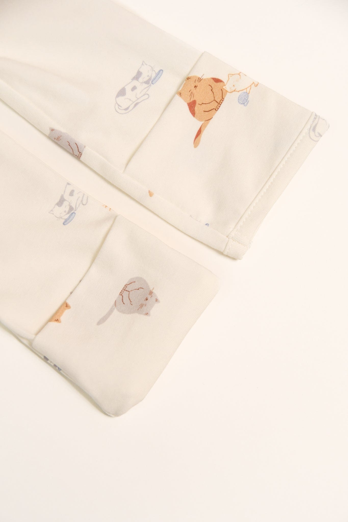 Close-up of cat-patterned clothing cuffs