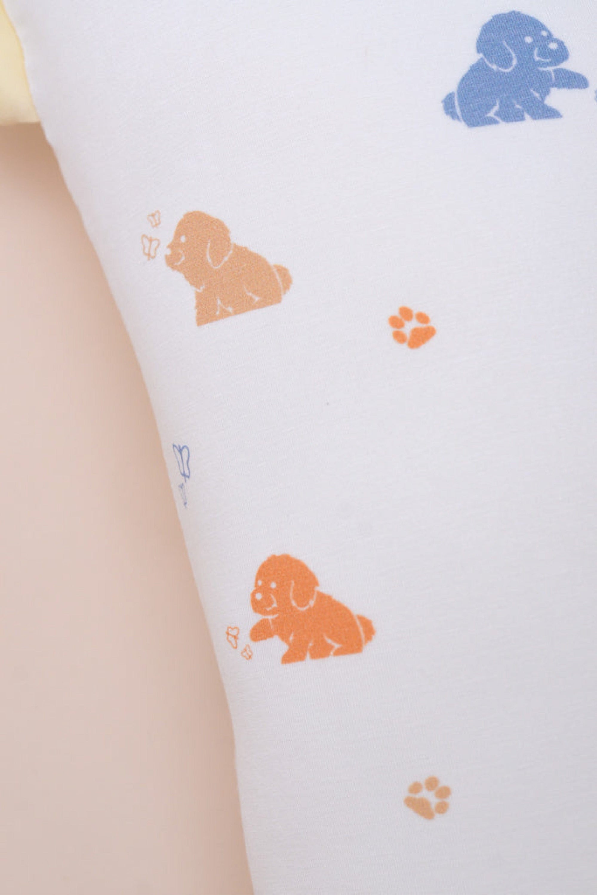 Close-up of pillow with puppy pattern