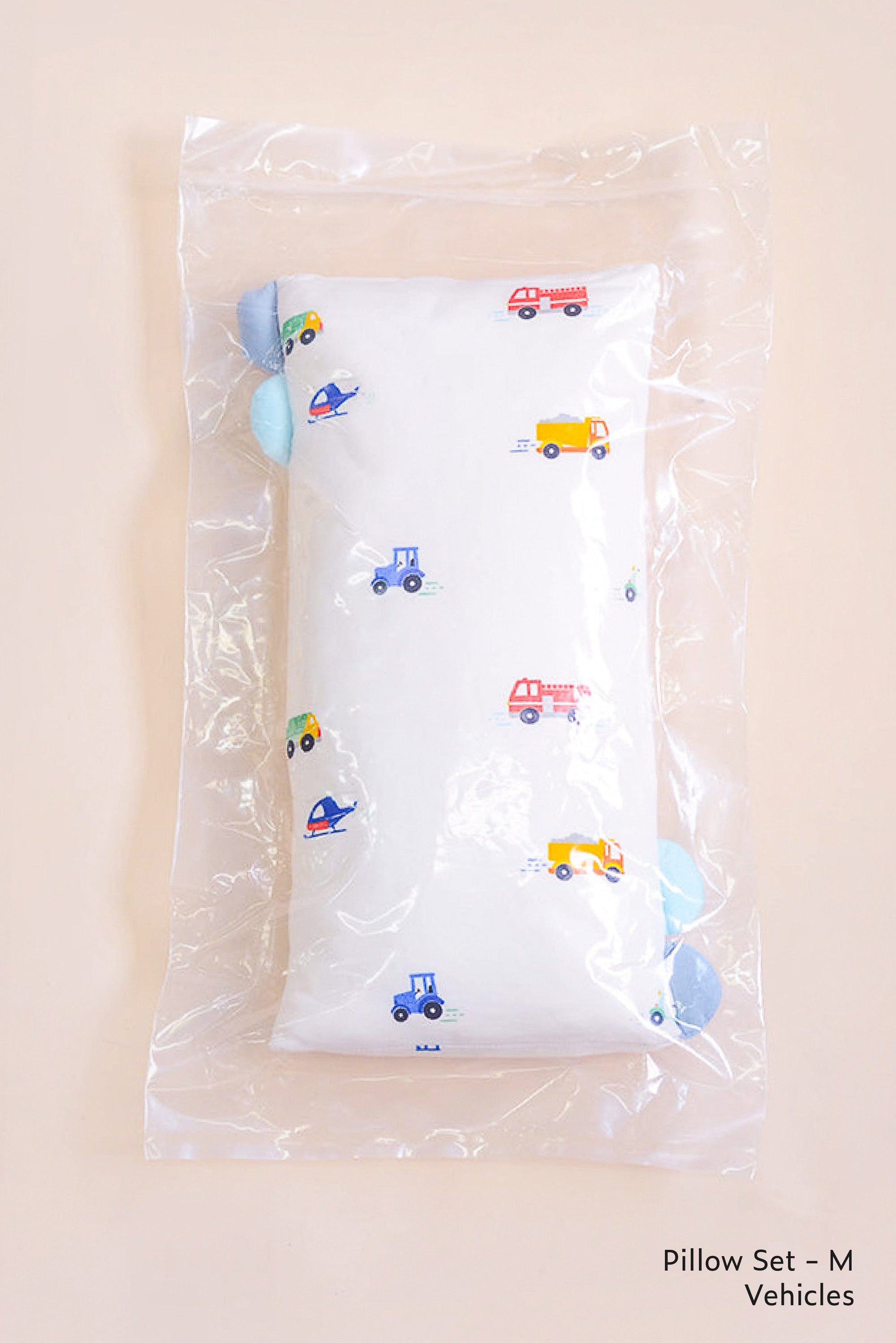 Pillow set M with vehicles pattern in plastic packaging.